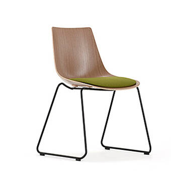 Wood chair with green seat pad and skid frame